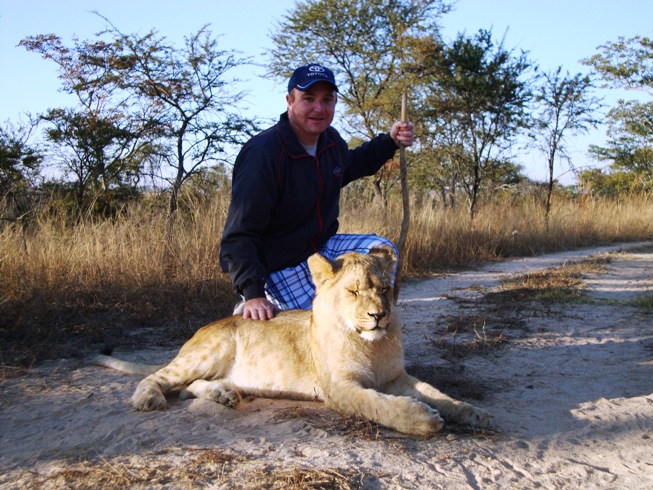 Sean with lion cub