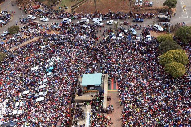 Thousands of Mugabe supporters gather at the party headquarters in Harare, Wednesday, July, 20, 2016. Tens of thousands of supporters of Zimbabwe's ruling party are marching in the capital in response to a series of recent protests against the government of 92-year-old President Robert Mugabe. The supporters sang and chanted slogans Wednesday in support of Mugabe, who has been in power for 36 years. (AP Photo/Tsvangirayi Mukwazhi)